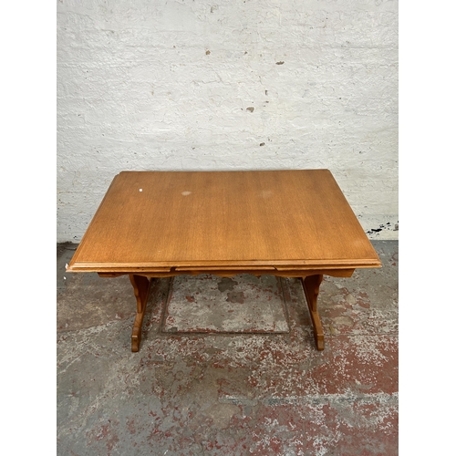 103 - An oak rectangular trestle dining table