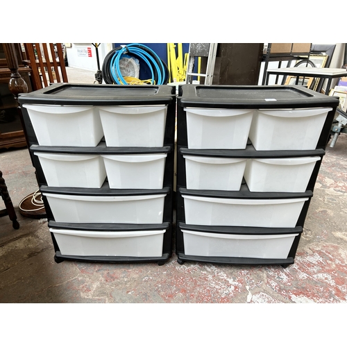 111 - Two plastic six drawer storage towers on castors