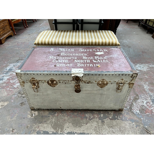 113 - An early 20th century painted travel trunk with contents