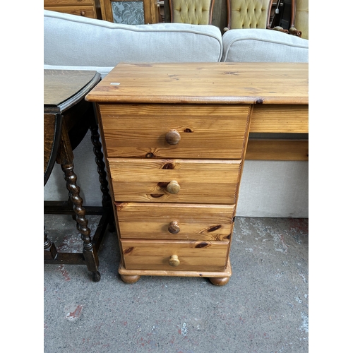 117 - A pine dressing table with eight drawers