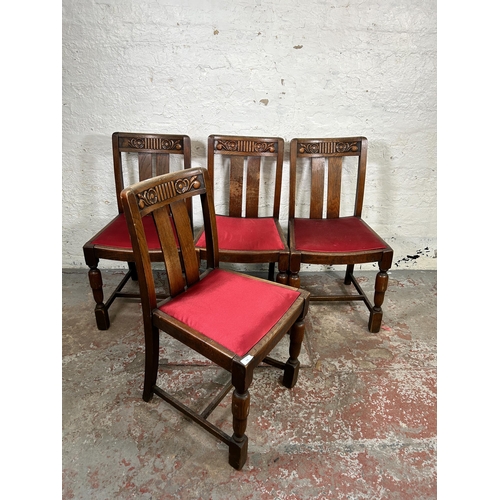 118 - A set of four 1930s carved oak dining chairs