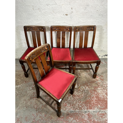 118 - A set of four 1930s carved oak dining chairs