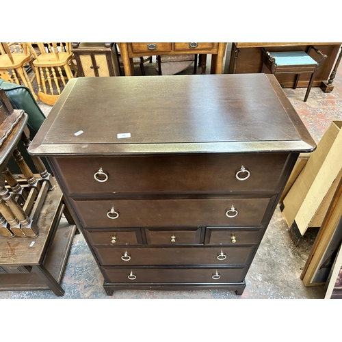 124 - A Stag Minstrel mahogany chest of three short and four long drawers