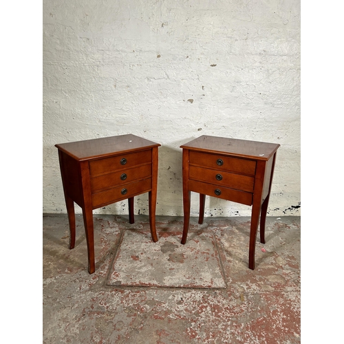 131 - A pair of Regency style inlaid mahogany effect bedside chests of three drawers