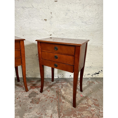 131 - A pair of Regency style inlaid mahogany effect bedside chests of three drawers