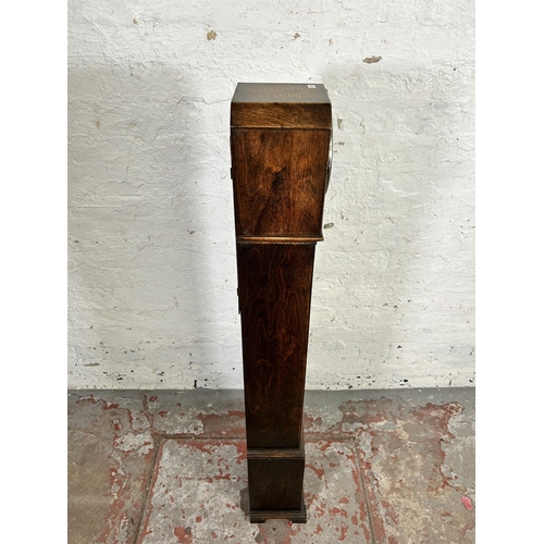 132 - A 1930s oak cased chiming granddaughter clock - approx. 126cm high