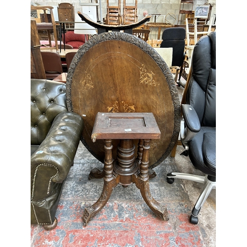 140 - A Victorian inlaid walnut oval loo table on quatrefoil base