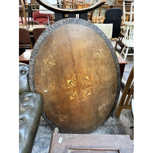 140 - A Victorian inlaid walnut oval loo table on quatrefoil base