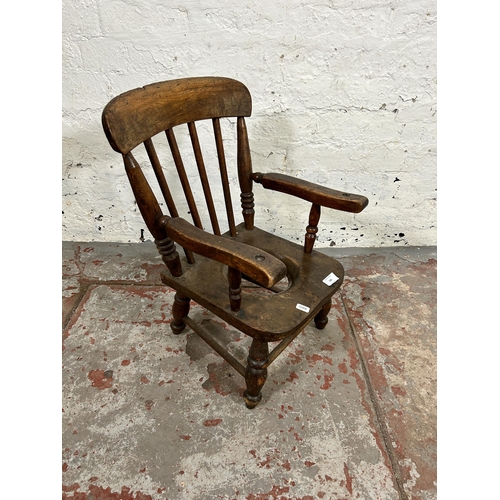 142 - A Victorian beech child's commode armchair