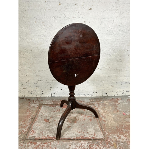 143 - A Georgian oak circular tilt top occasional table on tripod pedestal support