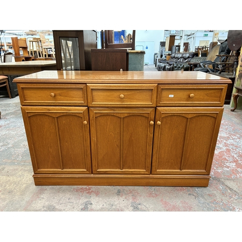 150 - A Stag teak sideboard with three drawers and three cupboard doors