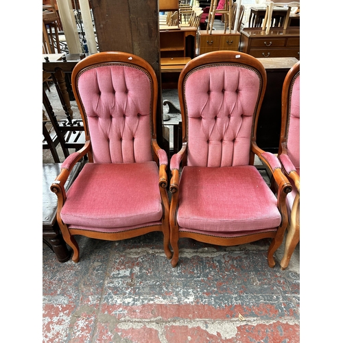 157 - A French style beech and pink fabric upholstered three piece lounge suite comprising two seater sofa... 