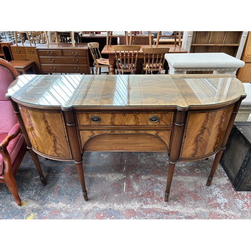 160 - A Regency style mahogany bow fronted sideboard with two cupboard doors and two drawers