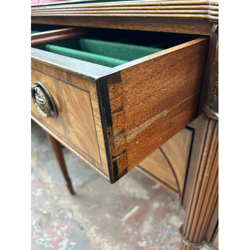 160 - A Regency style mahogany bow fronted sideboard with two cupboard doors and two drawers