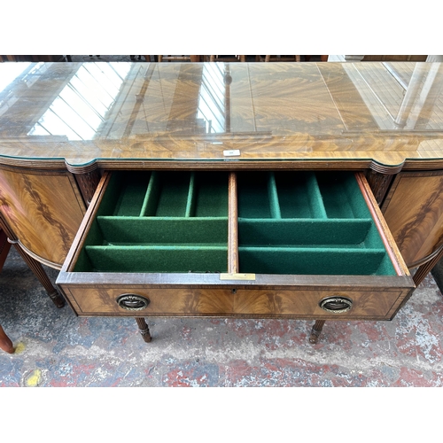 160 - A Regency style mahogany bow fronted sideboard with two cupboard doors and two drawers