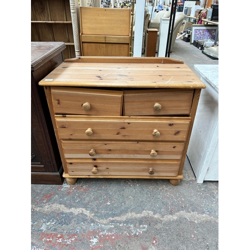 165 - A pine chest of two short over three long drawers