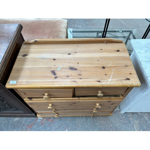 165 - A pine chest of two short over three long drawers