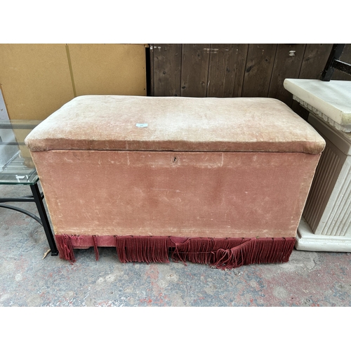 169 - A Victorian pine blanket box with later added upholstery