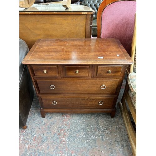 173 - A Stag Minstrel mahogany chest of three short over two long drawers