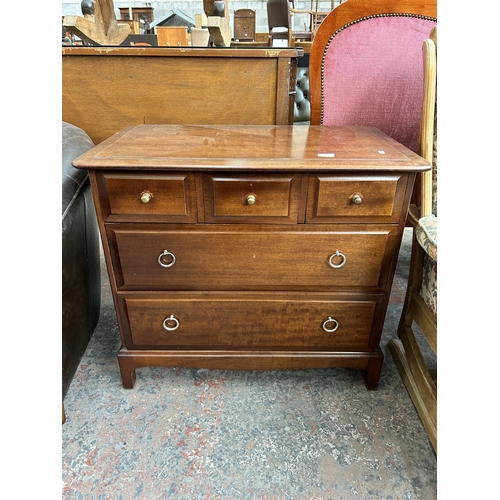 173 - A Stag Minstrel mahogany chest of three short over two long drawers