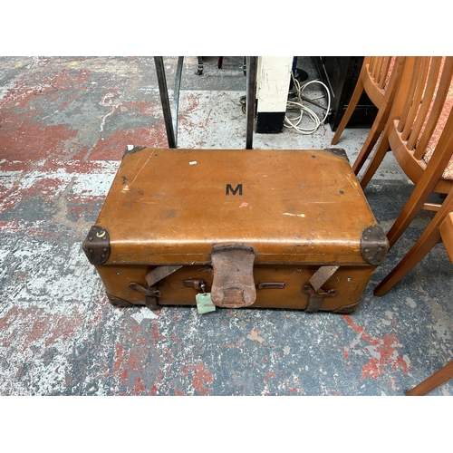 197 - An early 20th century brown leather travel trunk