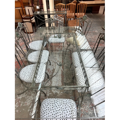 199 - A wrought iron and glass rectangular dining table and eight matching chairs