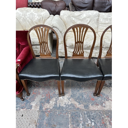 204 - Four Victorian mahogany and black vinyl dining chairs