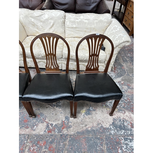 204 - Four Victorian mahogany and black vinyl dining chairs