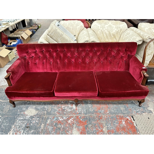 205 - A Victorian style mahogany and red fabric upholstered three seater parlour sofa