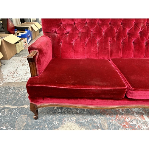 205 - A Victorian style mahogany and red fabric upholstered three seater parlour sofa