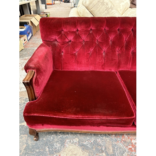 205 - A Victorian style mahogany and red fabric upholstered three seater parlour sofa