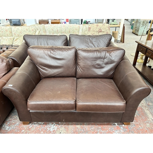 209 - A Marks & Spencer brown leather two seater sofa