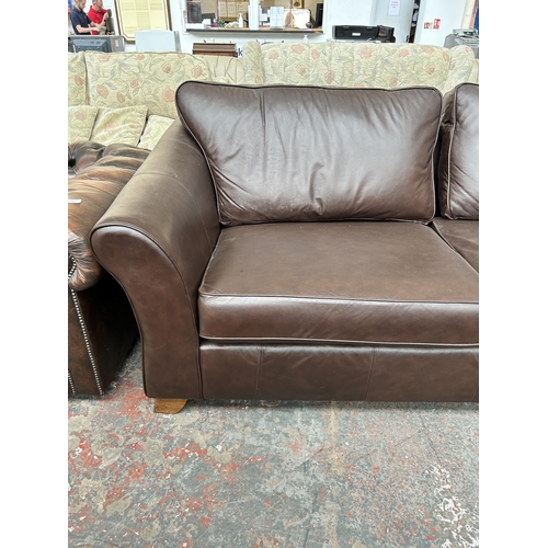 210 - A Marks & Spencer brown leather three seater sofa