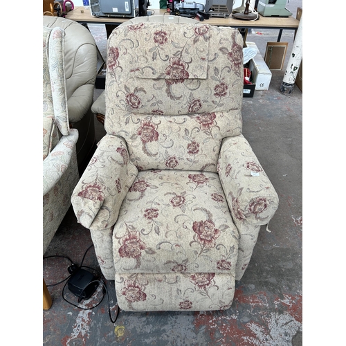 212 - A floral upholstered electric reclining armchair with remote and power supply