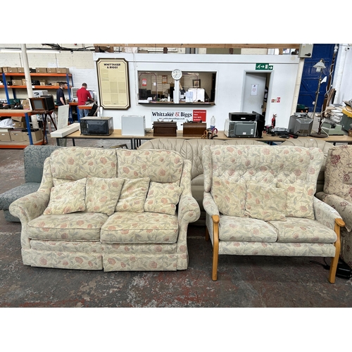 212A - Two floral upholstered two seater sofas