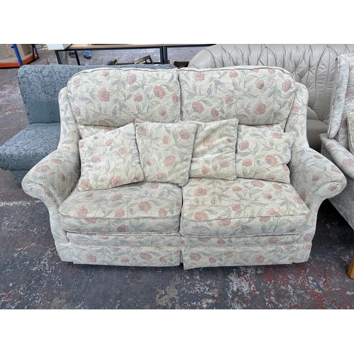 212A - Two floral upholstered two seater sofas