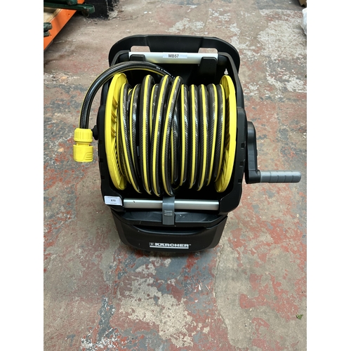 870 - A Karcher hose reel with Karcher Performance plus hose