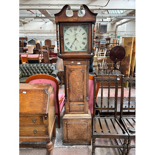 176 - A Georgian oak cased grandfather clock with hand painted enamel face, pendulum and weight