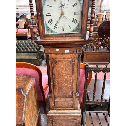 176 - A Georgian oak cased grandfather clock with hand painted enamel face, pendulum and weight