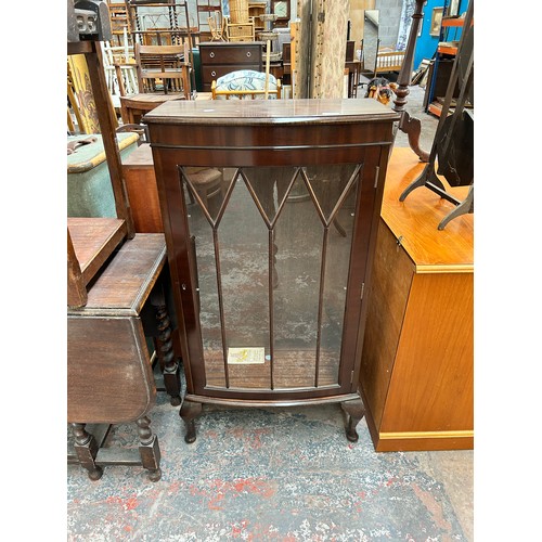 179 - A mahogany display cabinet with cabriole supports