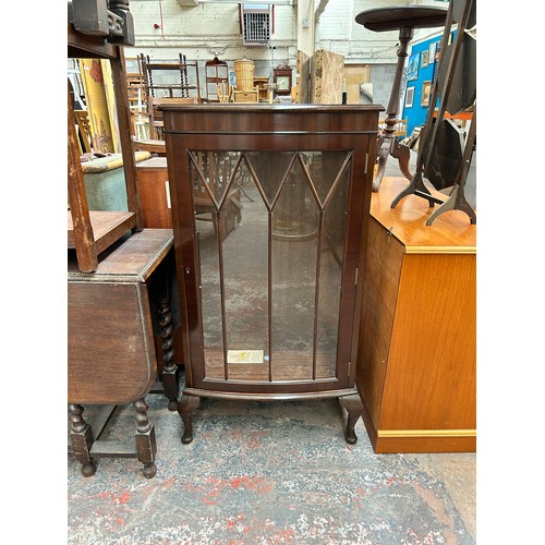 179 - A mahogany display cabinet with cabriole supports