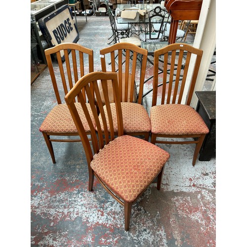 180 - A set of four oak dining chairs