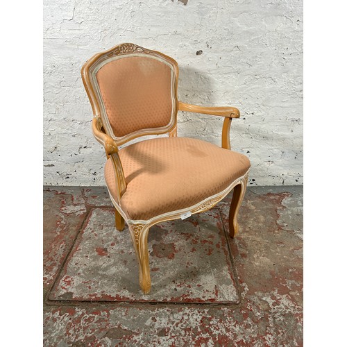 183 - A Louis XVI style beech and pink fabric upholstered armchair