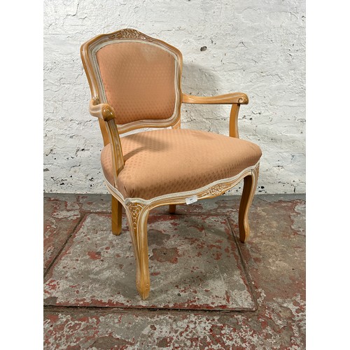 183 - A Louis XVI style beech and pink fabric upholstered armchair