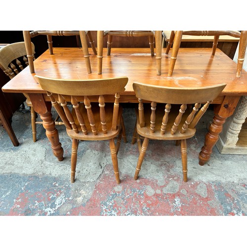 185 - A pine farmhouse dining table with six beech dining chairs