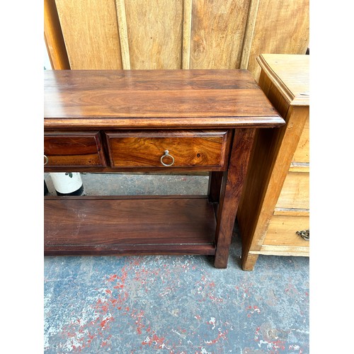 191 - An Indian sheesham wood three drawer console table