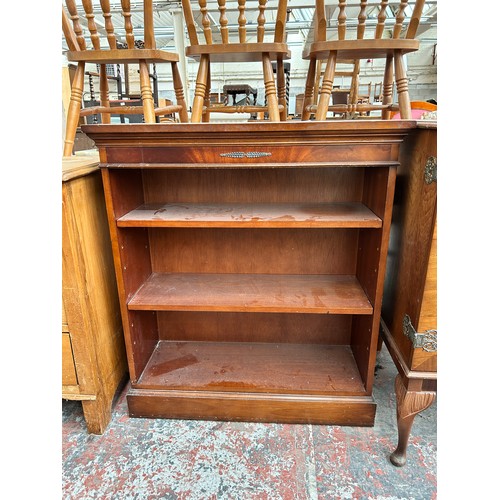 193 - Three pieces of furniture, one Georgian style mahogany three tier open bookcase, one yew wood nest o... 