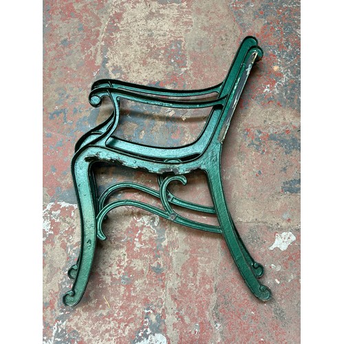 866 - A pair of cast iron garden bench ends