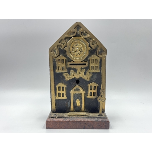 2272 - A Victorian brass and iron novelty bank money box - approx. 19cm high