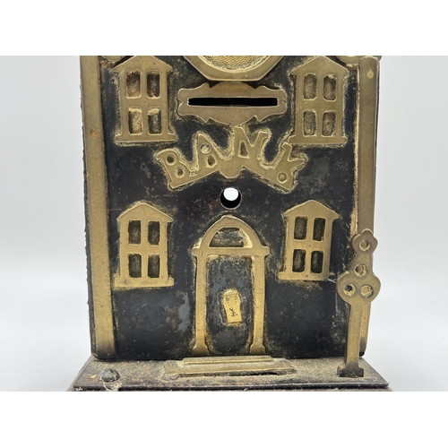 2272 - A Victorian brass and iron novelty bank money box - approx. 19cm high